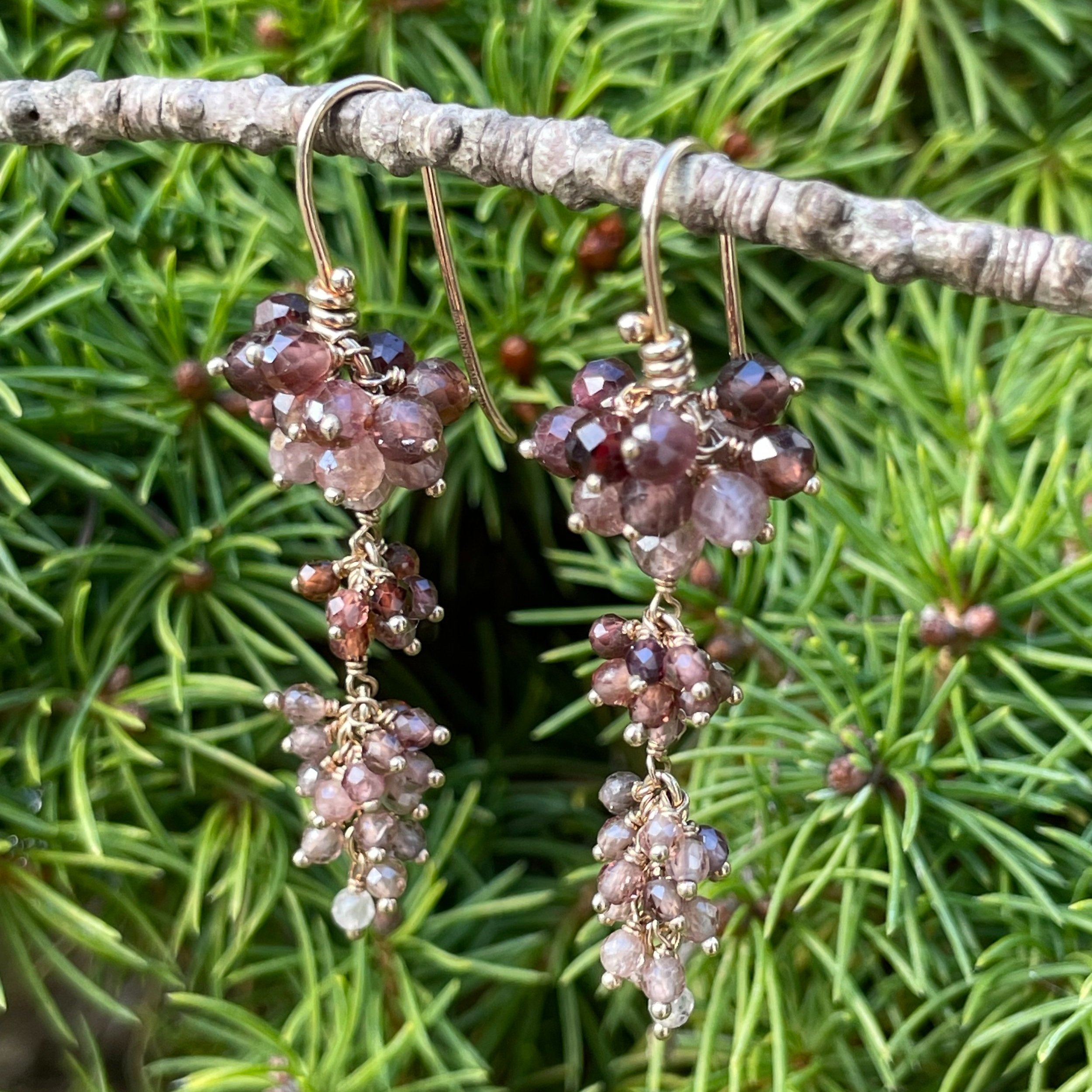 14K gold shaded brown gemstone bead cluster dangle earrings hanging on a branch