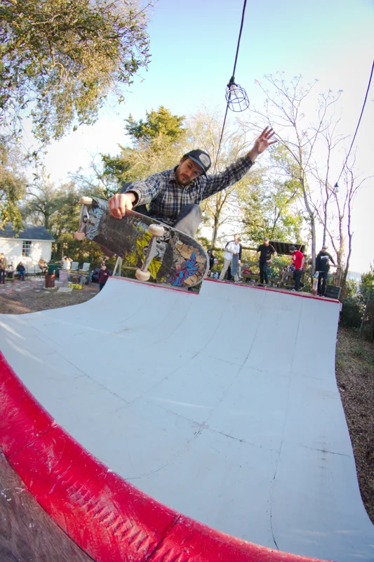 Jason Brant hovers above the coping, in the style of frontside air.