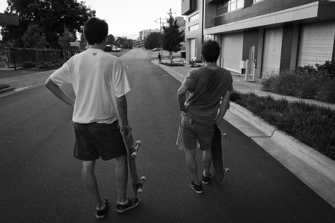 A couple of dudes checking out a few more dudes doing skateboard maneuvers. Goodbye Durham...