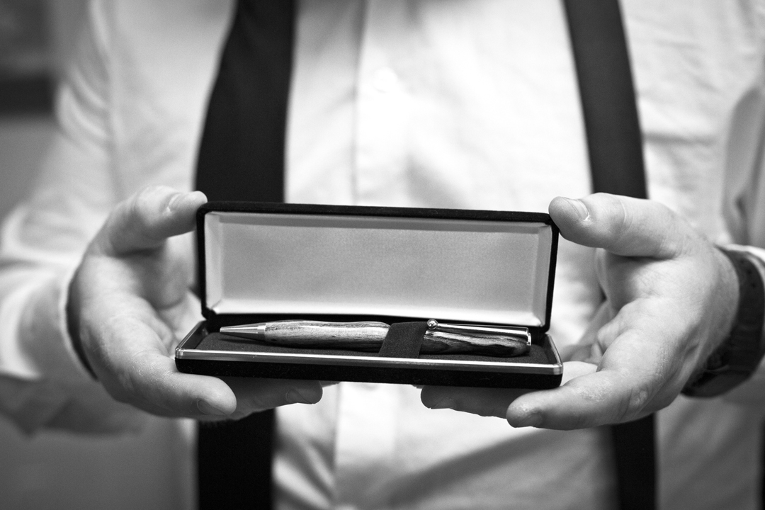 Custom hand made wooden pens for the groomsmen as made by the father of the bride.