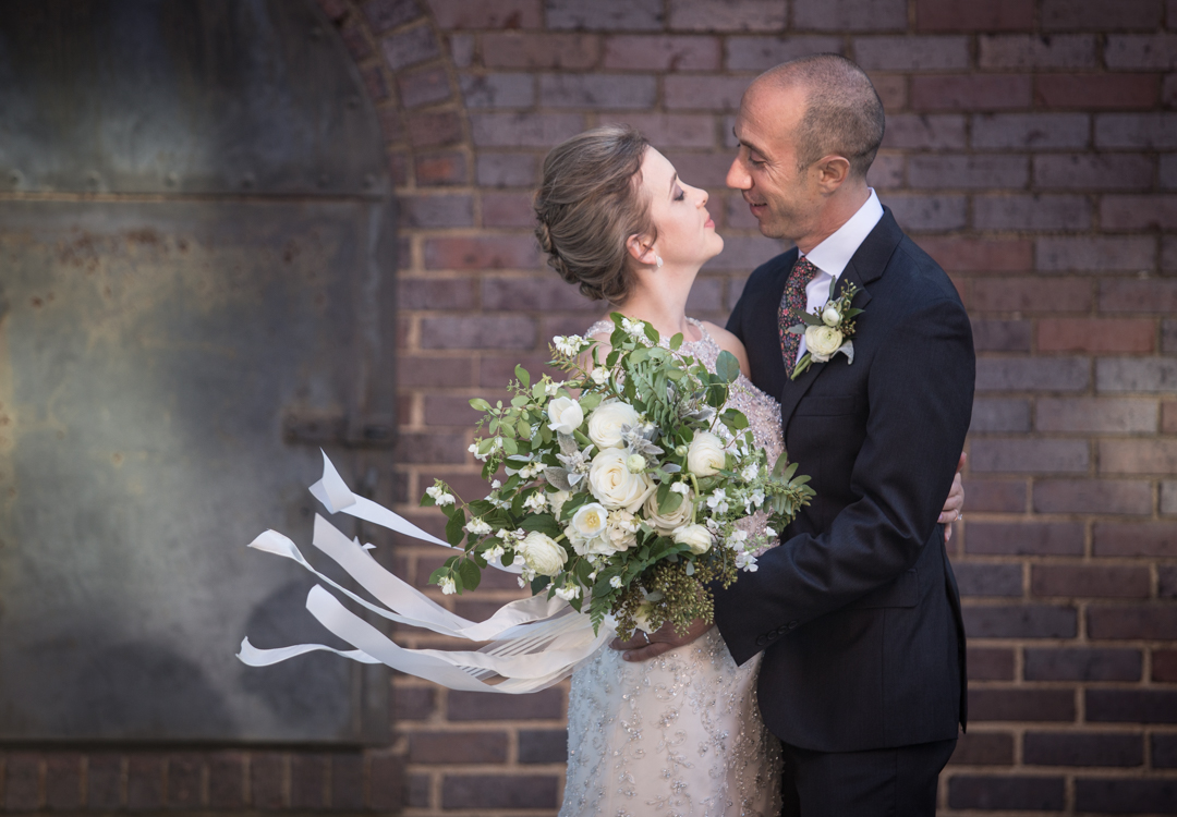Immediately after the ceremony, we hopped out into downtown Asheville to take some portraits. It was quite nice outside and the wind gave this photo a little action.