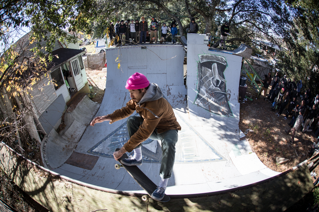 The man known sometimes as "Striker" does a crail grab 5-0 and does it well.