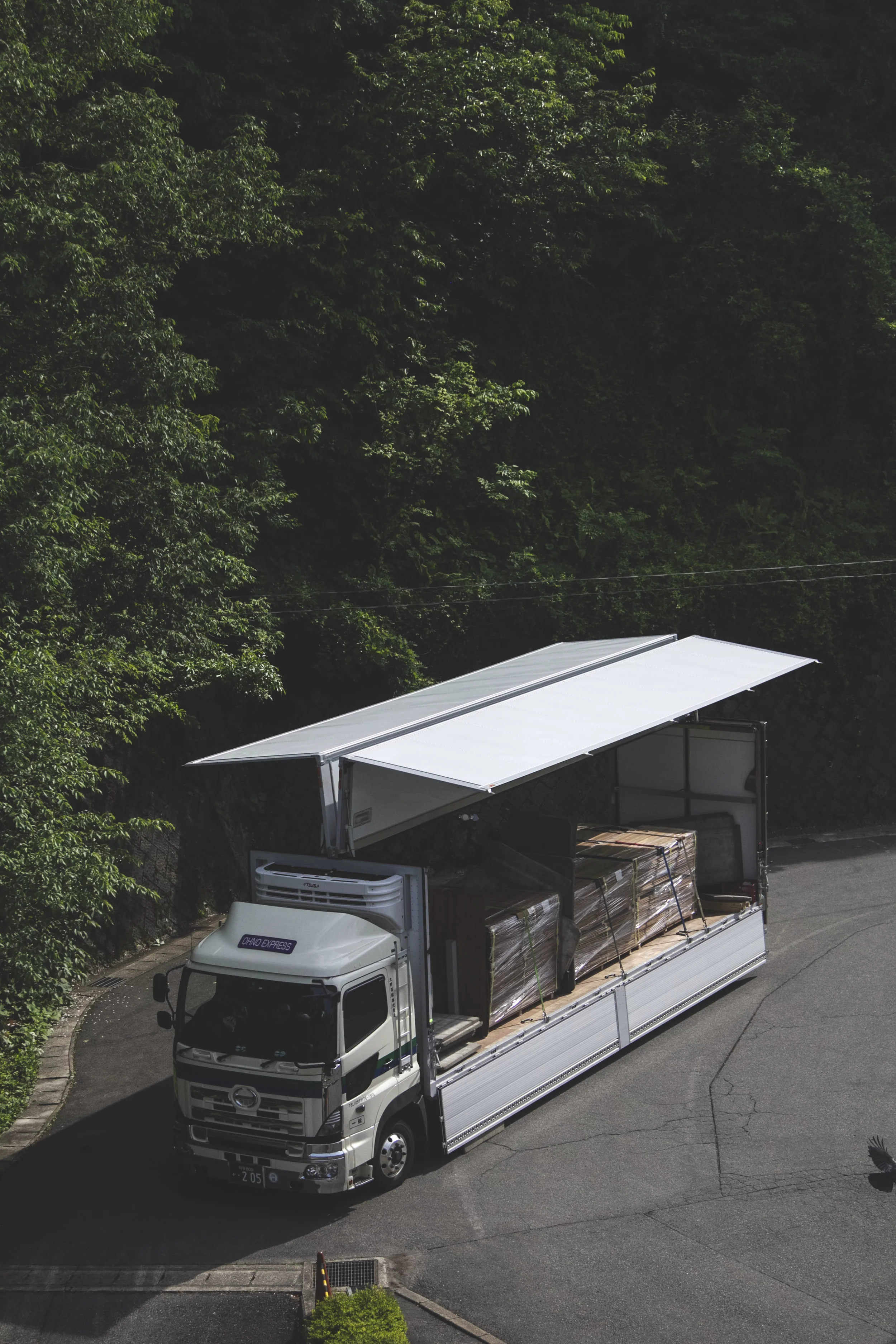 This side-accessed truck was unloading stuff outside. 