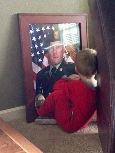 This little boy lost his dad (SFC Benjamin Wise ) in Afghanistan on January 15, 2013. Image Via Reddit
