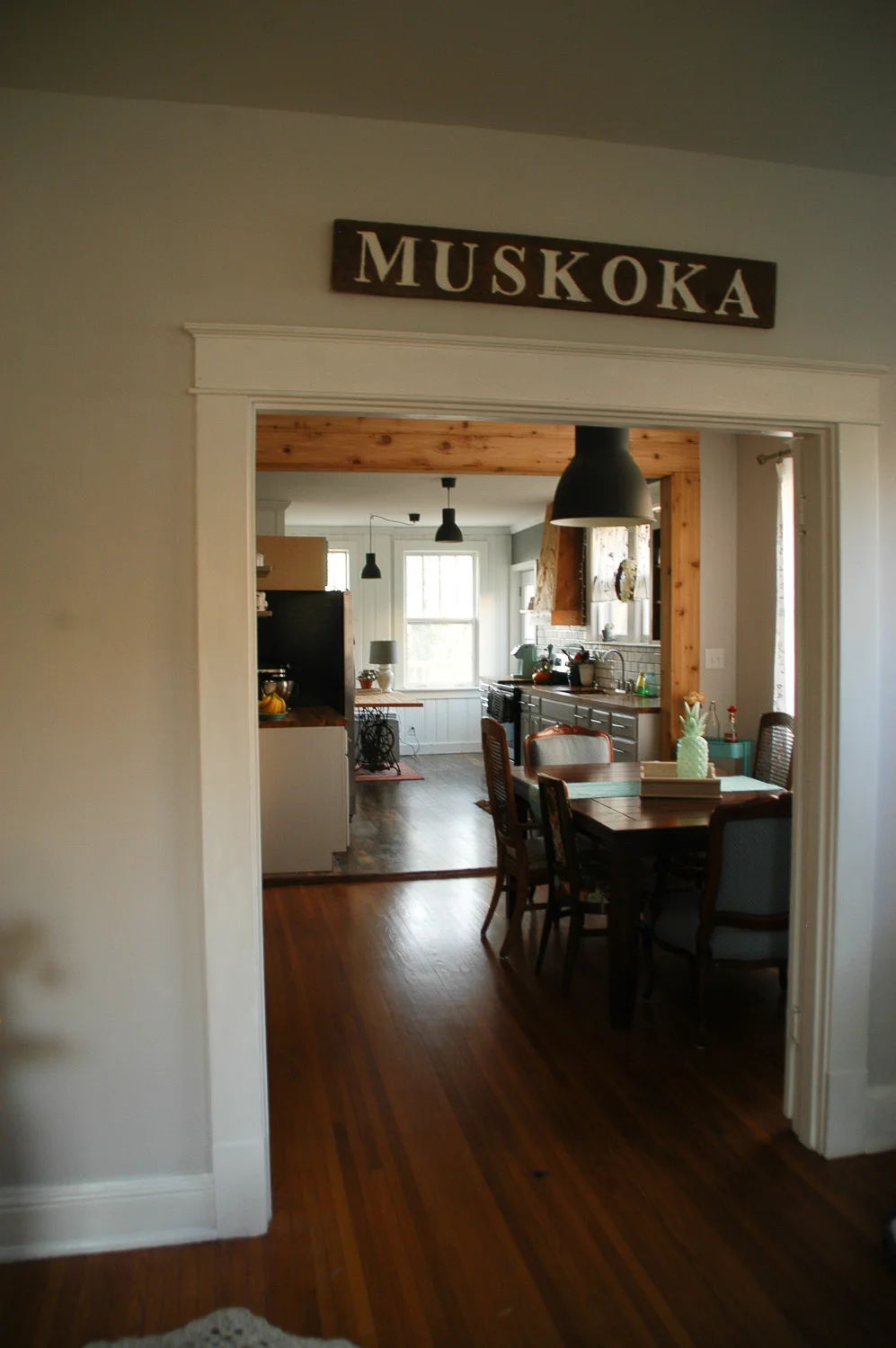 One thing we both really wanted in was an open concept, which can be hard to come by in older homes. But after figuring out the wall wasn't load bearing, Justin took it upon himself to knock it right down. You can find some before-and-afters further down.