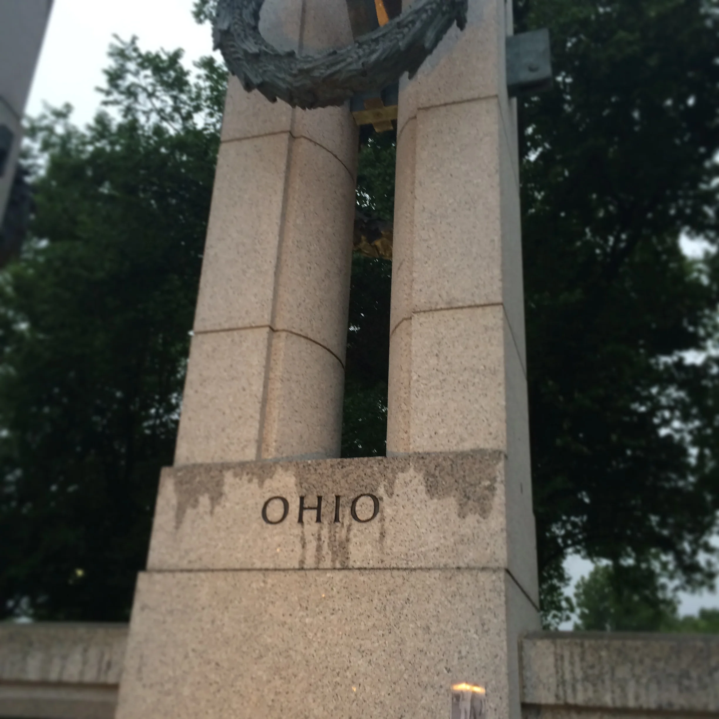 The Ohio pillar of the World War II Memorial. Note the taped photograph at the bottom right of the pillar.