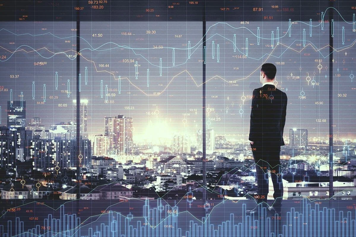 Business professional overlooking a city with digital analytics and data visualizations representing integrated systems and streamlined workflows