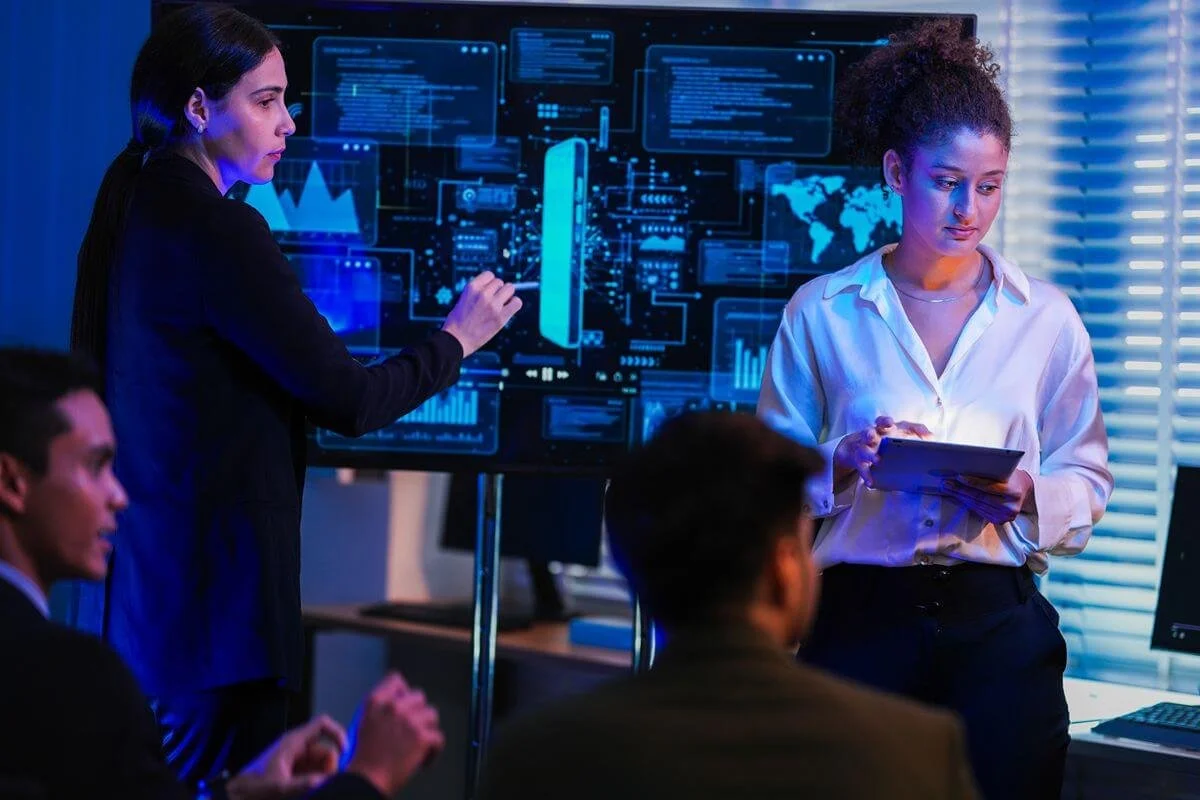 IT professionals monitoring enterprise systems and digital dashboards while evaluating SAP S/4HANA support and system performance