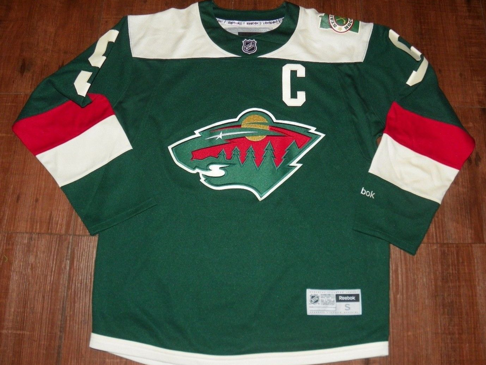 Hockey Unplugged - The Minnesota Wild's policy of attaching their “Tria”  jersey advertisement to every jersey sold at their store and on the store's  website has caused a huge uproar from hockey
