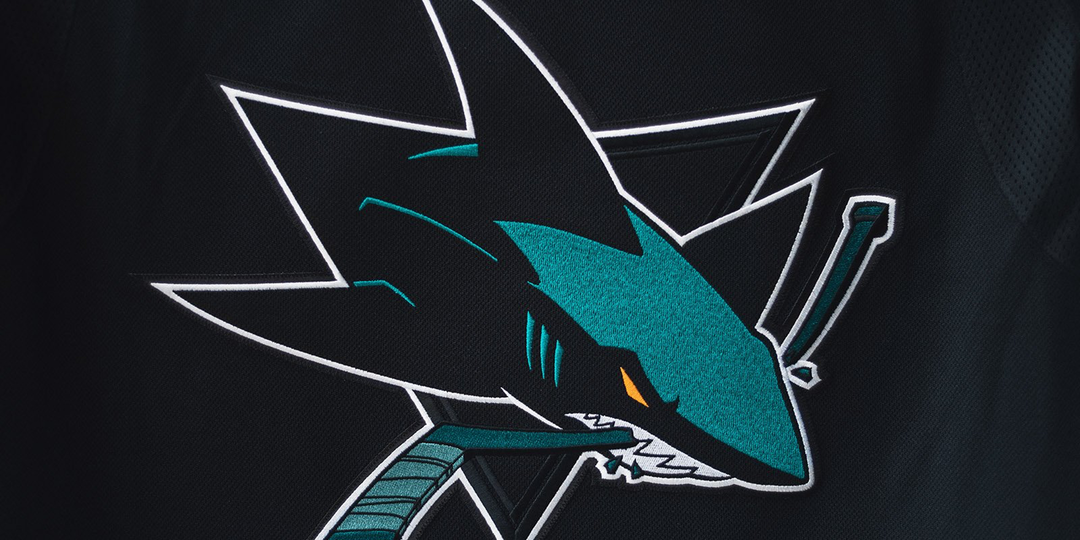 Duotone jersey concept for the San Jose Sharks of the NHL. Circle/Fin  secondary logo used as main crest. Line placement and thickness to evoke  the feeling of a shark swimming through the
