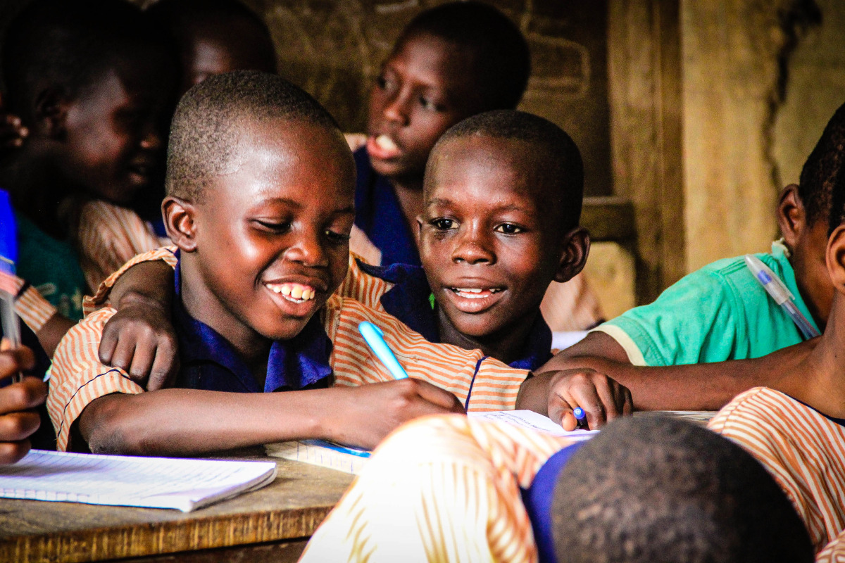   Two little boys in grade 1 at Ilaje Community School, laughing together in the safe environment of their classroom, despite the many challenges they face at home.&nbsp;  