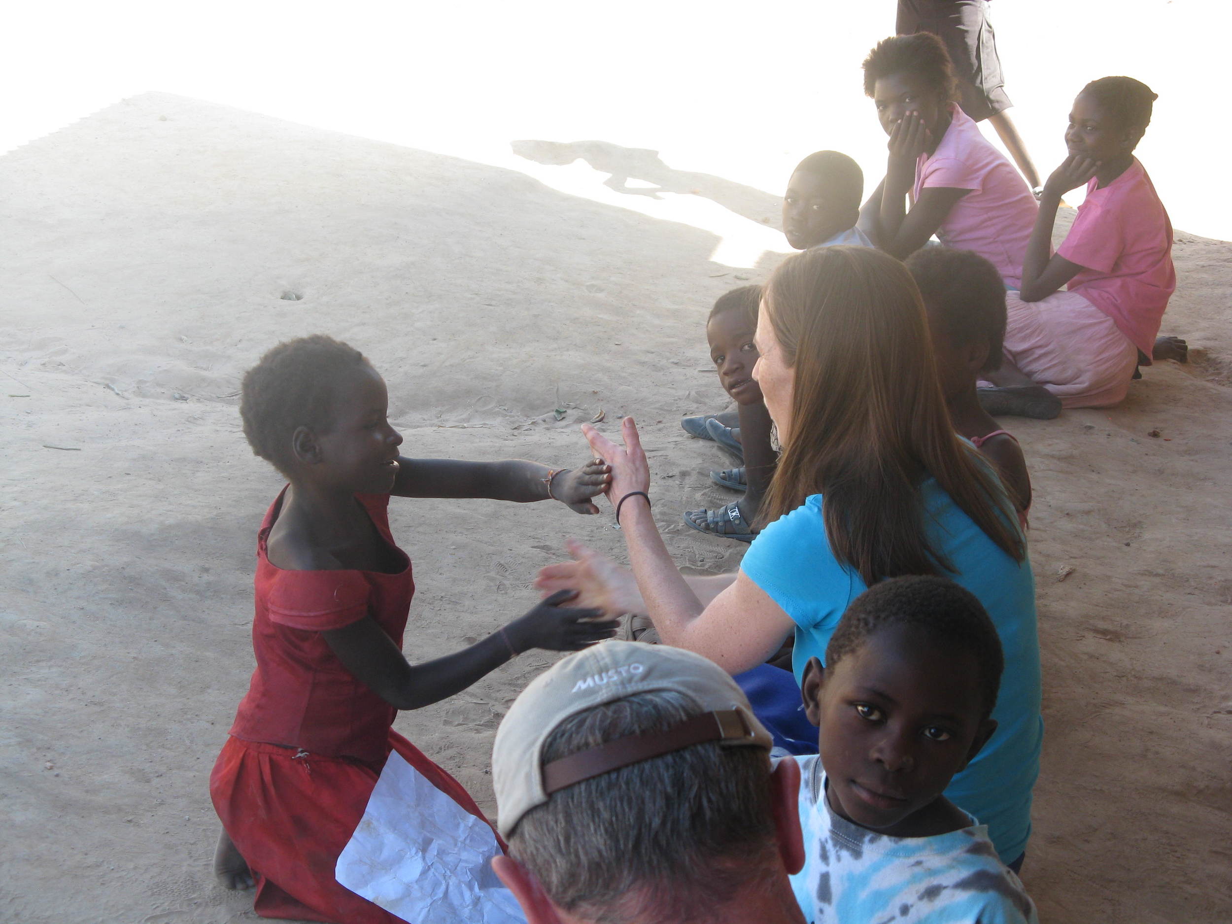 Team members from The Forge connecting with children in Maposa