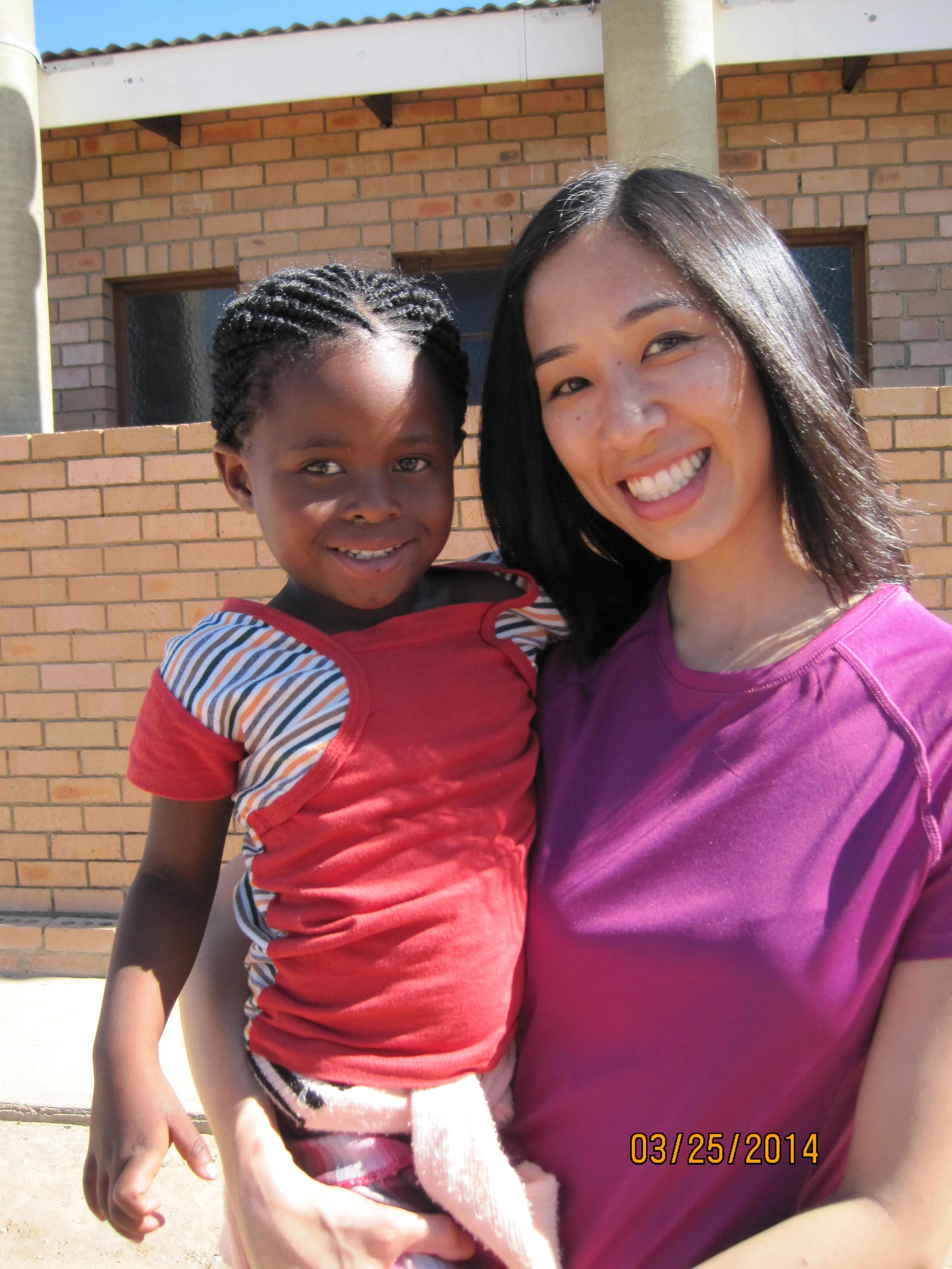 Michelle and her new friend in Africa