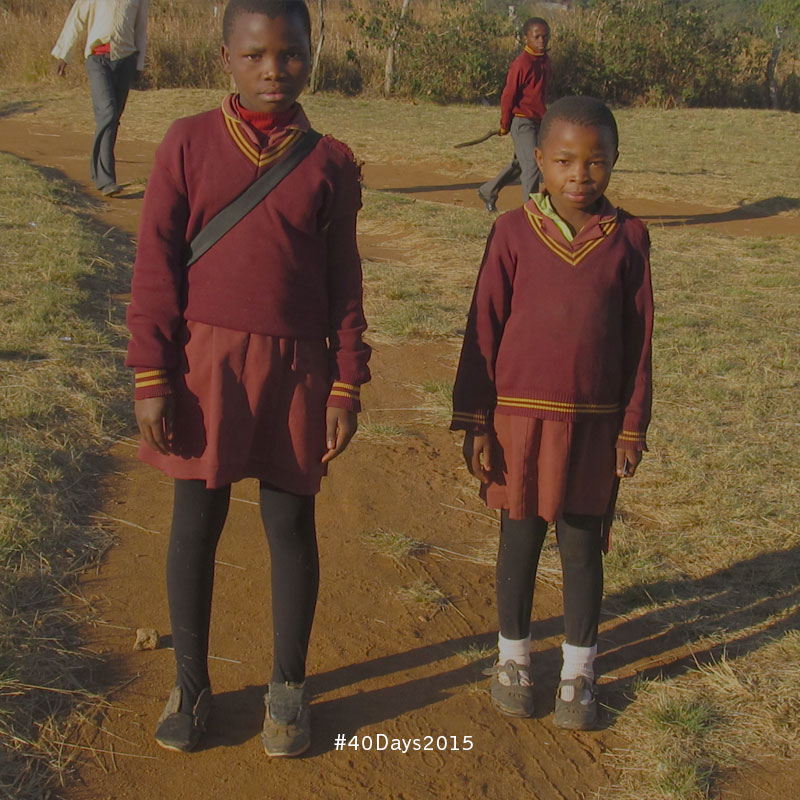  Two young girls on their way to school in Swaziland