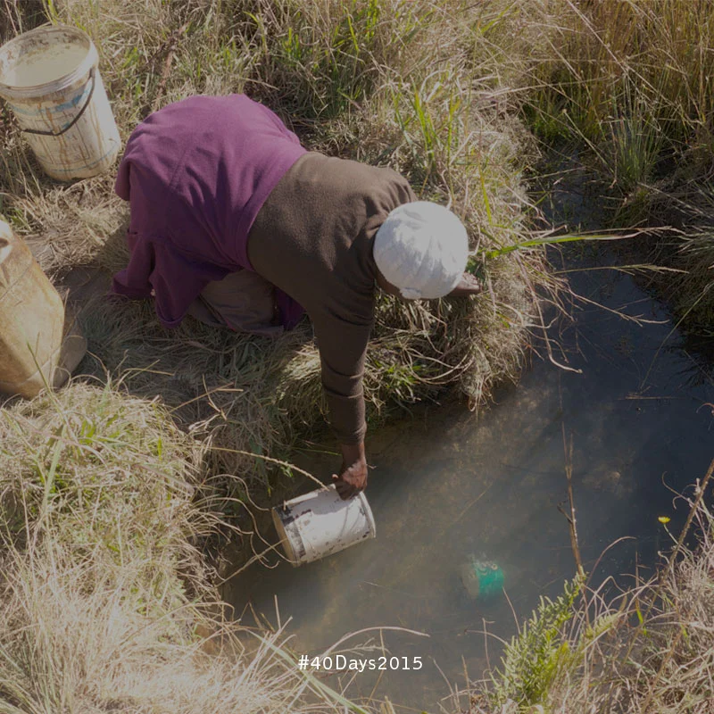 Fetching water in the community of Oshoek, South Africa