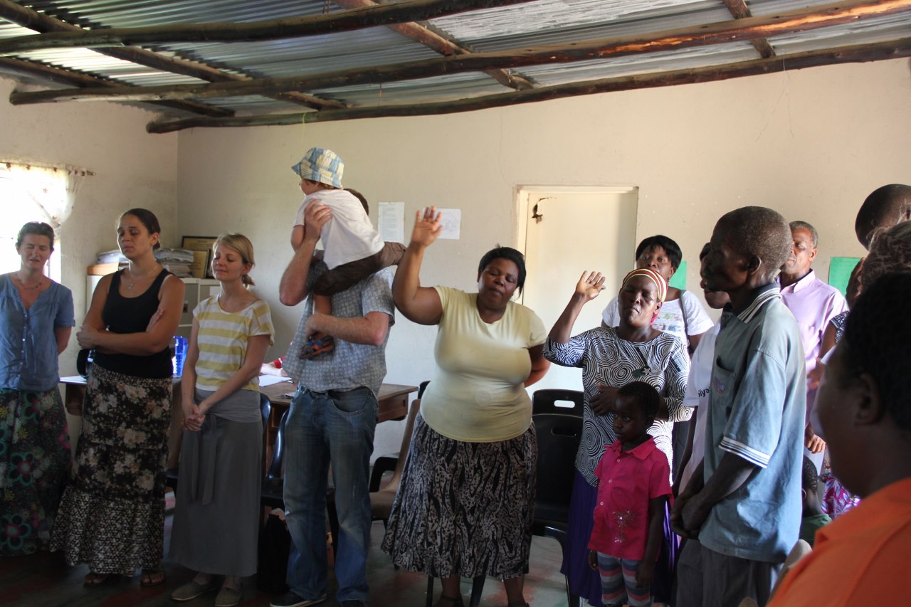 Jen, second from left, joining local and international volunteers in worship in South Africa