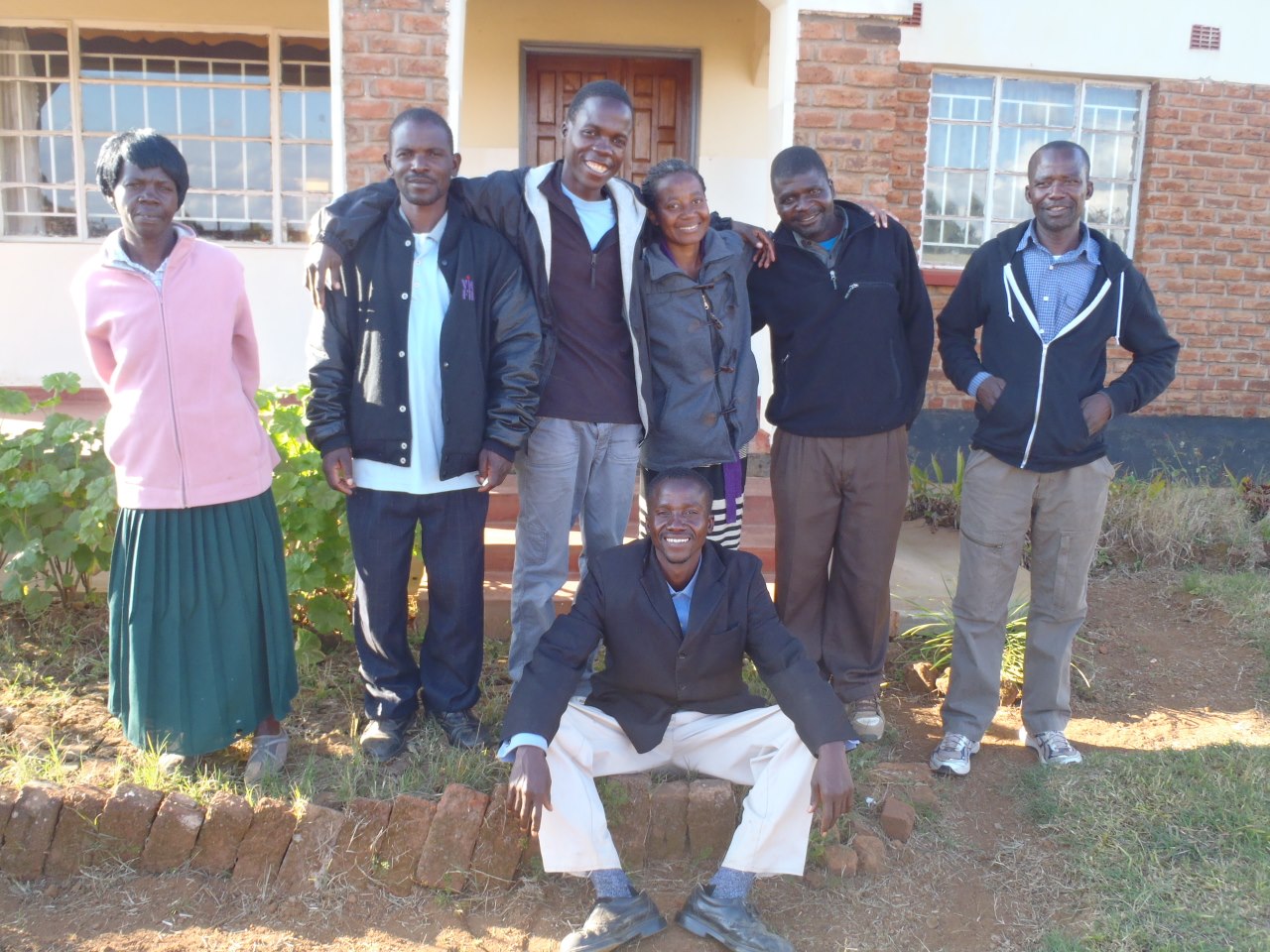 Hands at Work local team in Malawi (L-R): Violet, Prince, Tanazio, Ivy, Symon, Royie + Butwell (seated)