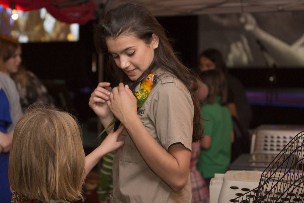  Children interacting with exotic animals we don’t have in Canada. 