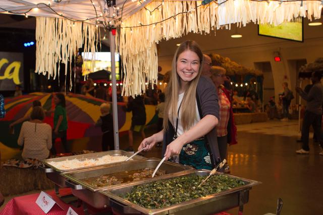  Westside volunteers serving a selection of delicious African foods. 