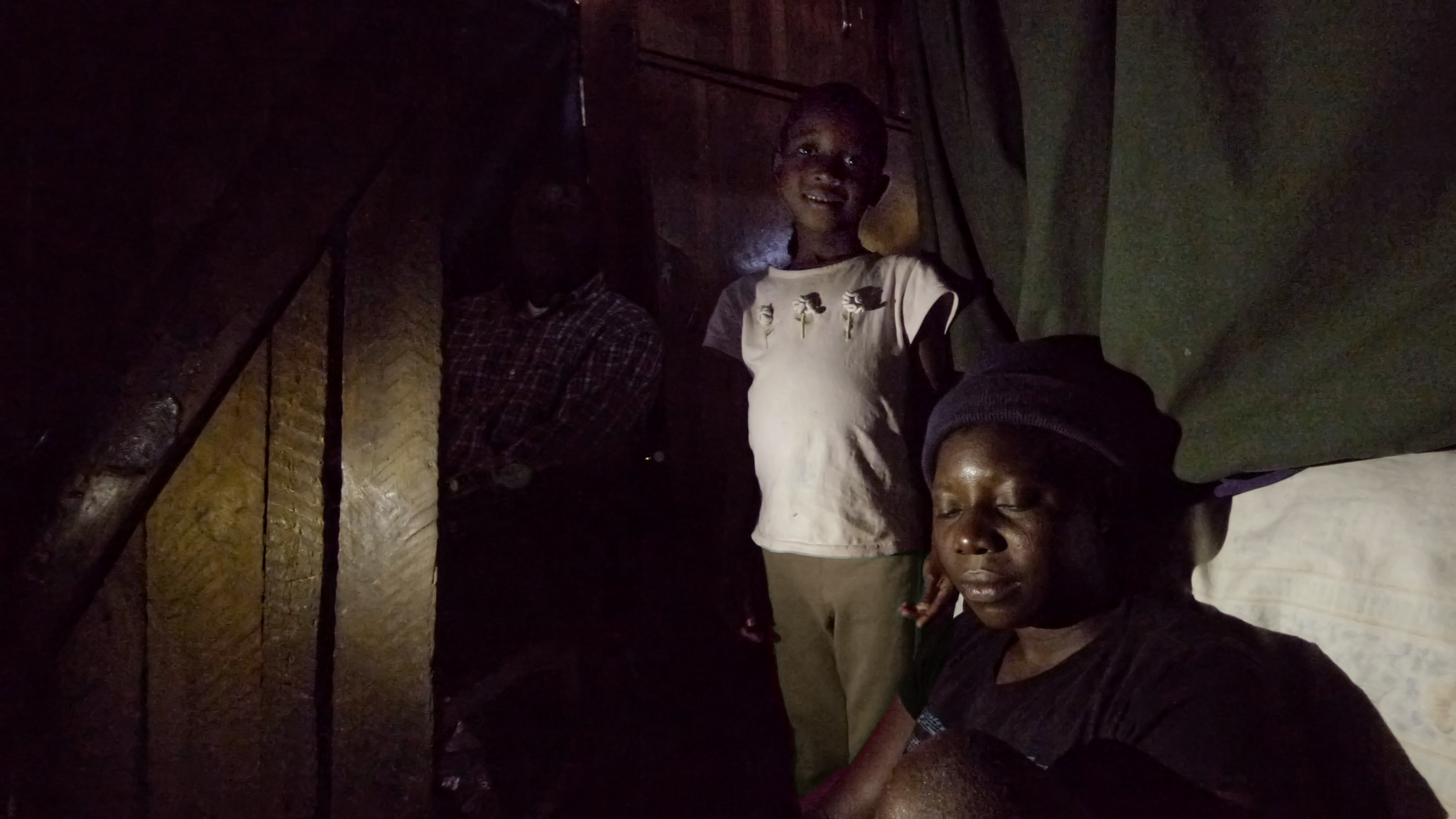  Across town from the Care Point and beyond the Sakubva market more families have been identified as desperately needing care. These two families live in rooms in the back of a church. The only light in the rooms comes from gaping holes in the wall b