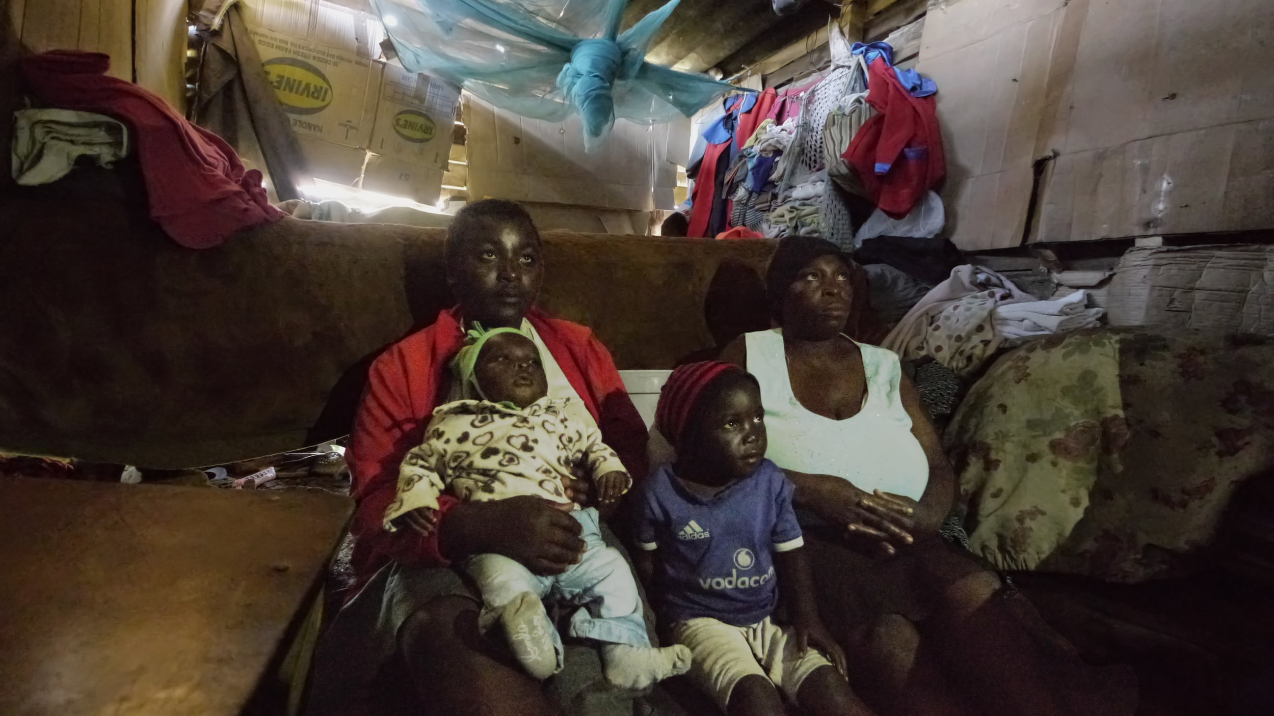  Across town from the Care Point and beyond the Sakubva market more families have been identified as desperately needing care. These two families live in rooms in the back of a church. The only light in the rooms comes from gaping holes in the wall b