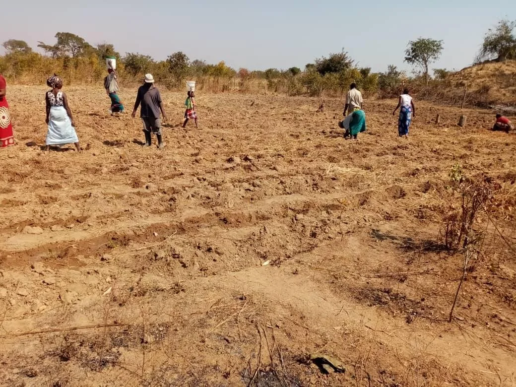 Praying for the local Hands at Work team in Kabwe