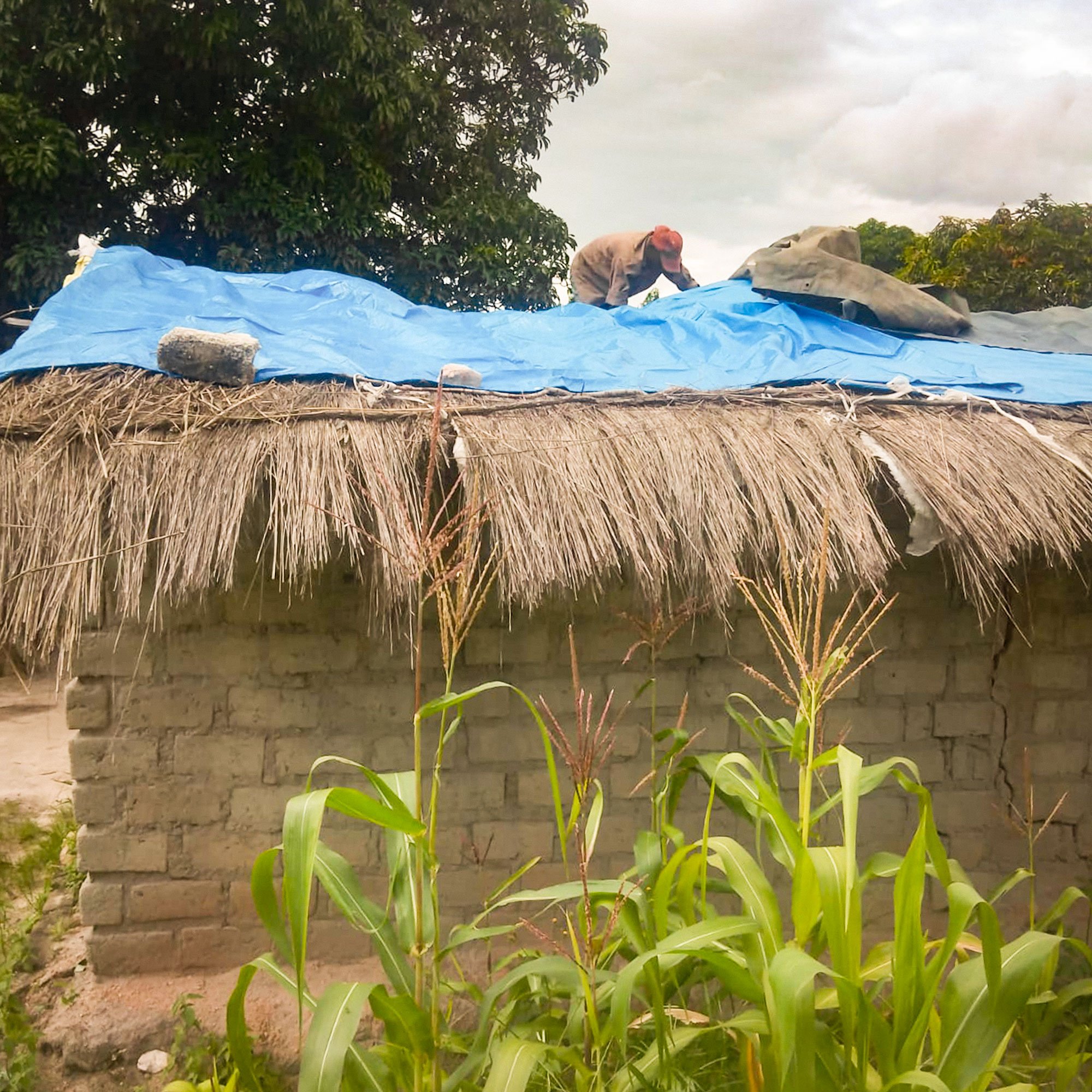  In Nissi Community Gogo Esther and her six grandchildren received a temporary repair to their roof,  which will serve until a permanent home can be constructed. 