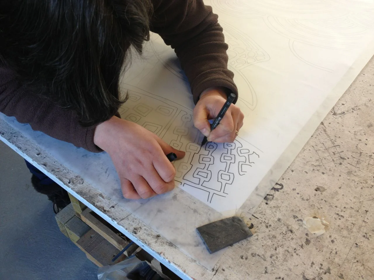 Tracing the full-size digital printouts onto drafting film.