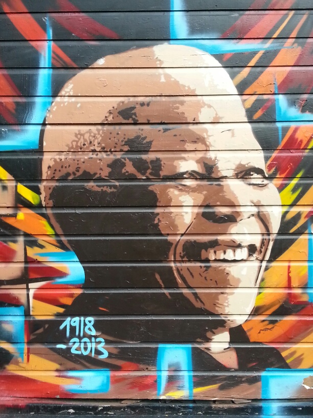 Street mural tribute to Nelson Mandela in Amsterdam's Dam Square area