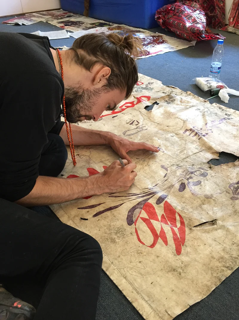 Artist Justin Orvis Steimer completing a work. He exhibited in the Fall of 2014. Courtesy of the Catinca Tabacaru Gallery.