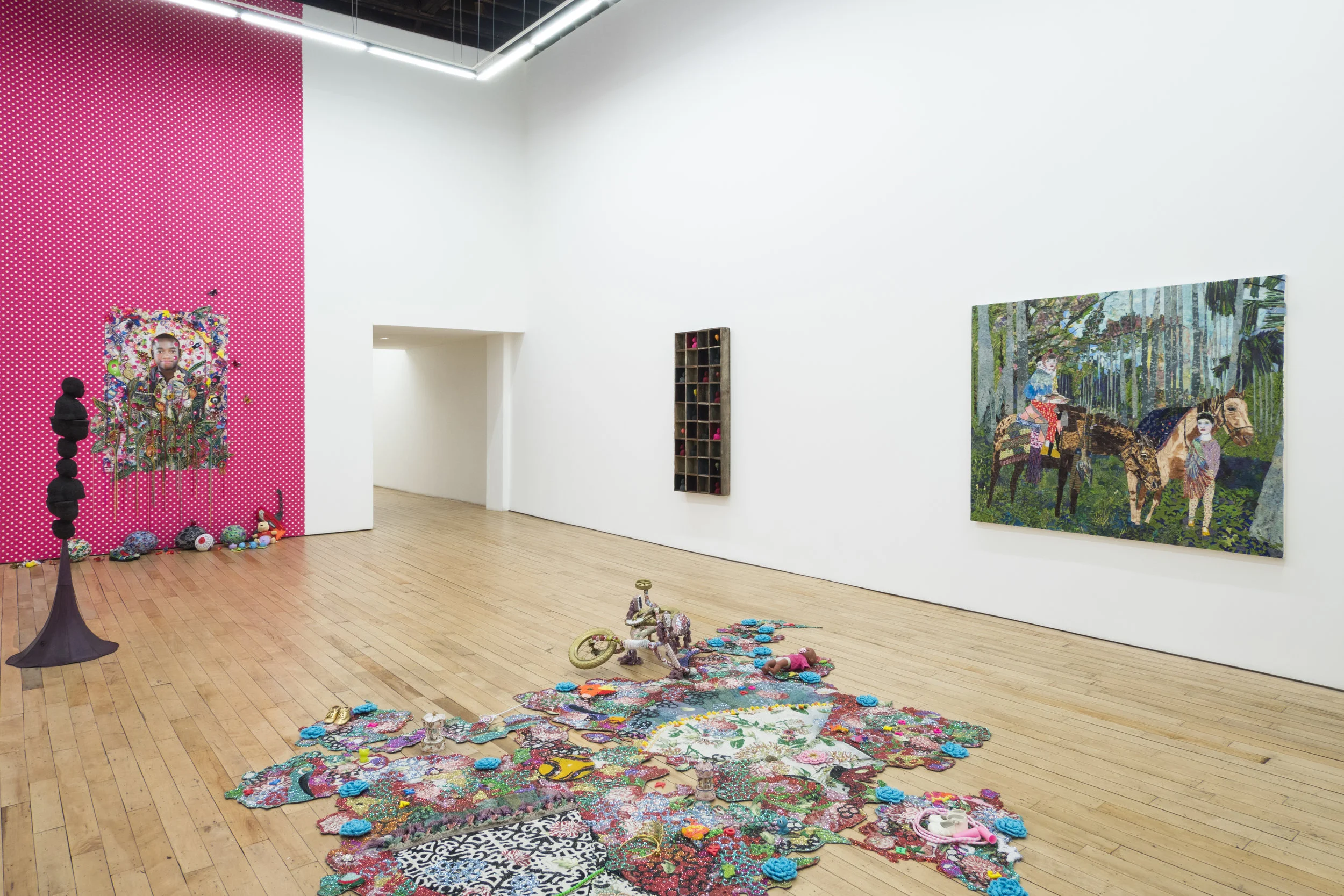 Installation view of 'All That Glitters', work by Ebony G. Patterson, Derek Fordjour, and Maria Berrio. Courtesy of the Rachel Uffner Gallery. 