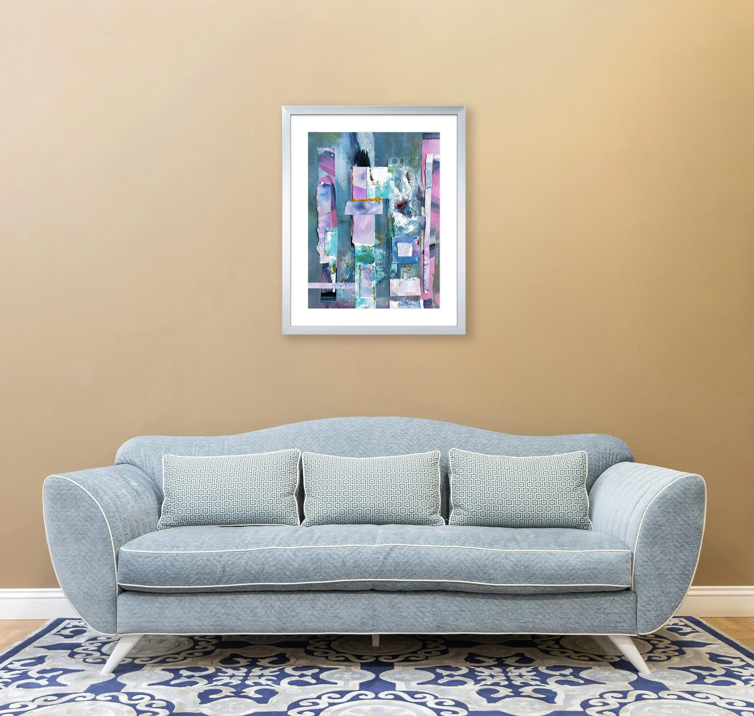 Golden Stretch of a Day, mixed media collage in silver frame over sofa, by Ceil Diskin