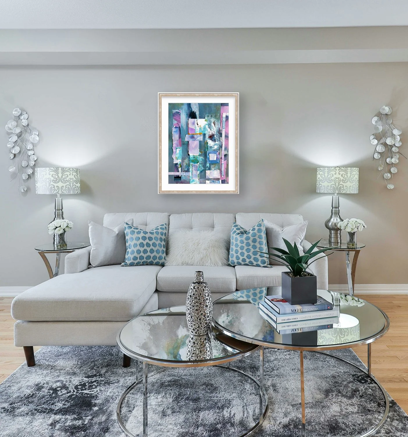 Golden Stretch of a Day, mixed media collage in pewter metallic frame over grey sofa, by Ceil Diskin