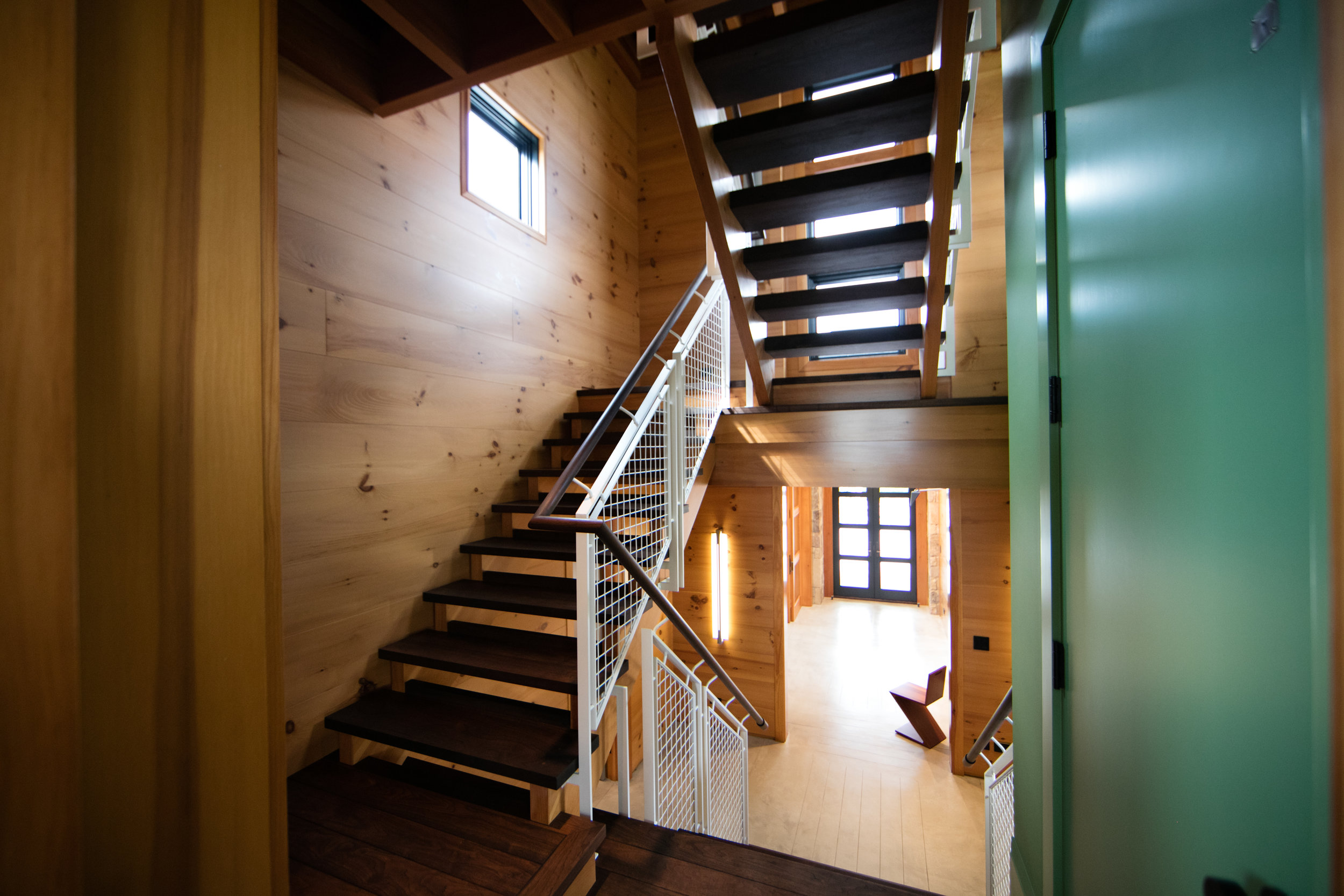 Modern staircase in farmhouse