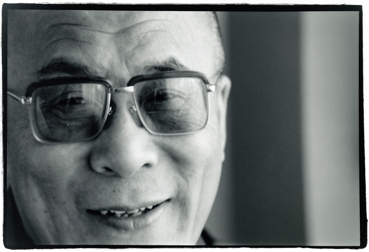 Tenzin Gyatso, 14th Dalai Lama. Mark Jacobson , fresh from Dharamsala, was doing a followup interview for a profile of, as he called him, ‘The D.L.’ I blagged my way into accompanying him as photographer. This was shot in the DL’s hotel suite