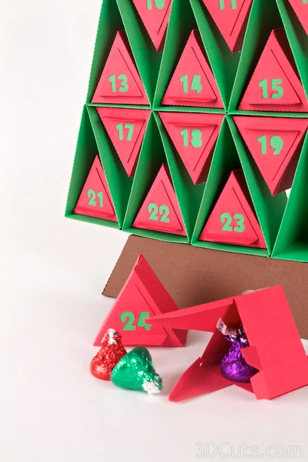 Paper Advent Calendar designed by Marji Roy of 3dcuts.com. Cutting files in SVG, PDF, and DXF formats available for cutting on Silhouette or Cricut. Complete tutorial included.