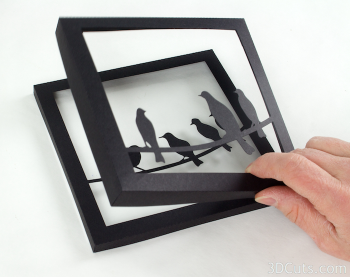 Frame 3 gets adhered inside frame 2 using Glue Dots or another adhesive.