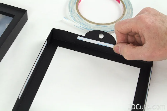 I added Scor Tape to all four edges of frame 1 but didn't peel the covering until the frames were placed together.