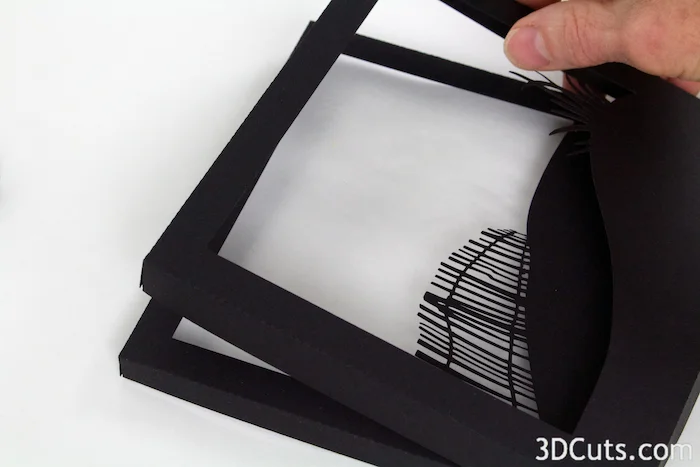 1. Place frame 2 over frame 3. Align back edges so there is a space between the two,
