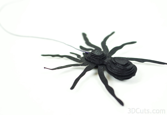 Here is the spider with the string attached and all the layers glued in place.