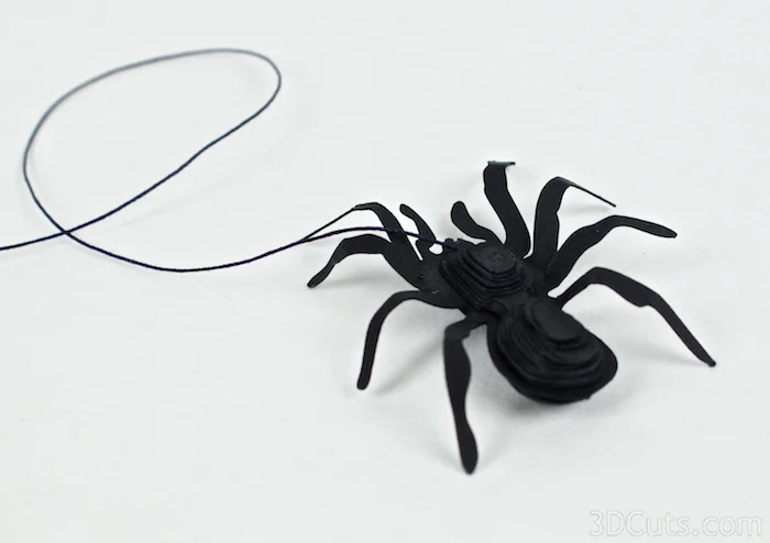 Bend the spiders legs up and then down to make it more spider like.