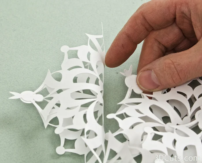 View 2: Study the design and look for a good place to glue the triangles together a little further out. The Calligraphic snowflake has a good point to split and glue to the triangle next door.