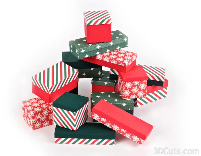3d Christmas present centerpiece constructed from card stock. SVG,PDF, PNG, DXF cutting files available from 3dcuts.com. Designed by Marji Roy