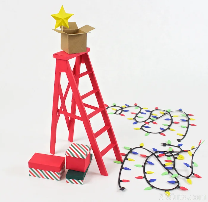 3d Christmas Ladder centerpiece constructed from card stock. SVG,PDF, PNG, DXF cutting files available from 3dcuts.com. Designed by Marji Roy