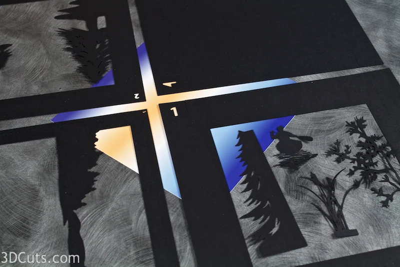 Canoe at Sunrise Shadow Box in paper by Marji Roy of 3dcuts.com. Cutting files in svg, pdf, and dxf formats for Silhouette and Cricut cutting machines