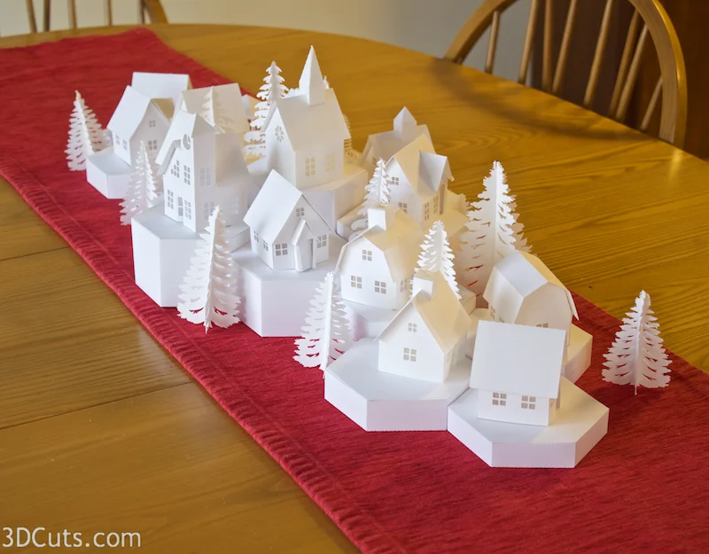 Stunning 3D illuminated tea light village by Marji Roy of 3dcuts.com. SVG, PDF, PNG and DXF cutting files and complete tutorials available.