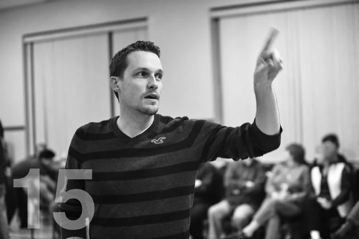 Eric Dalbey gives instruction to the leads during a rehearsal. Photo by Joel Currier