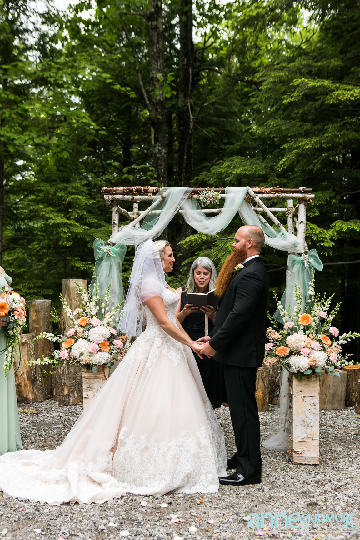 Mark and Barbie say I do at a rustic barn wedding in Norway, Maine officiated by A Sweet Start. Photo by Anne Skidmore Photography