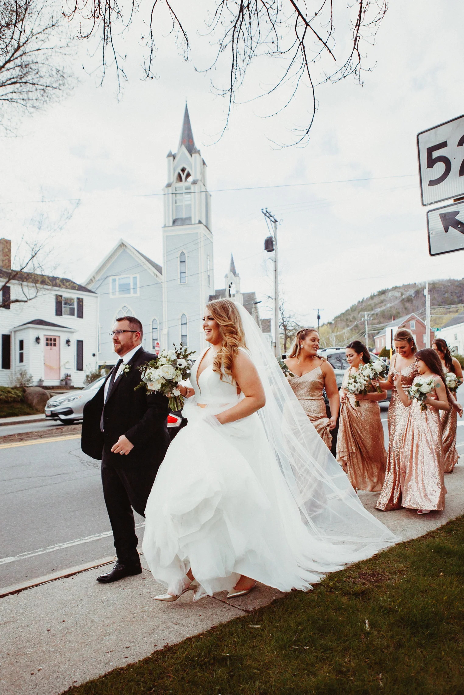 Bride and groom walking through Camden Maine after their wedding