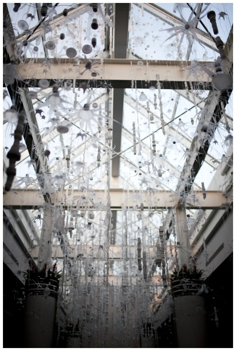 We walked through this room that was all decorated for a wedding reception. This ceiling art is made entirely out of recycled water bottles! How COOL!
